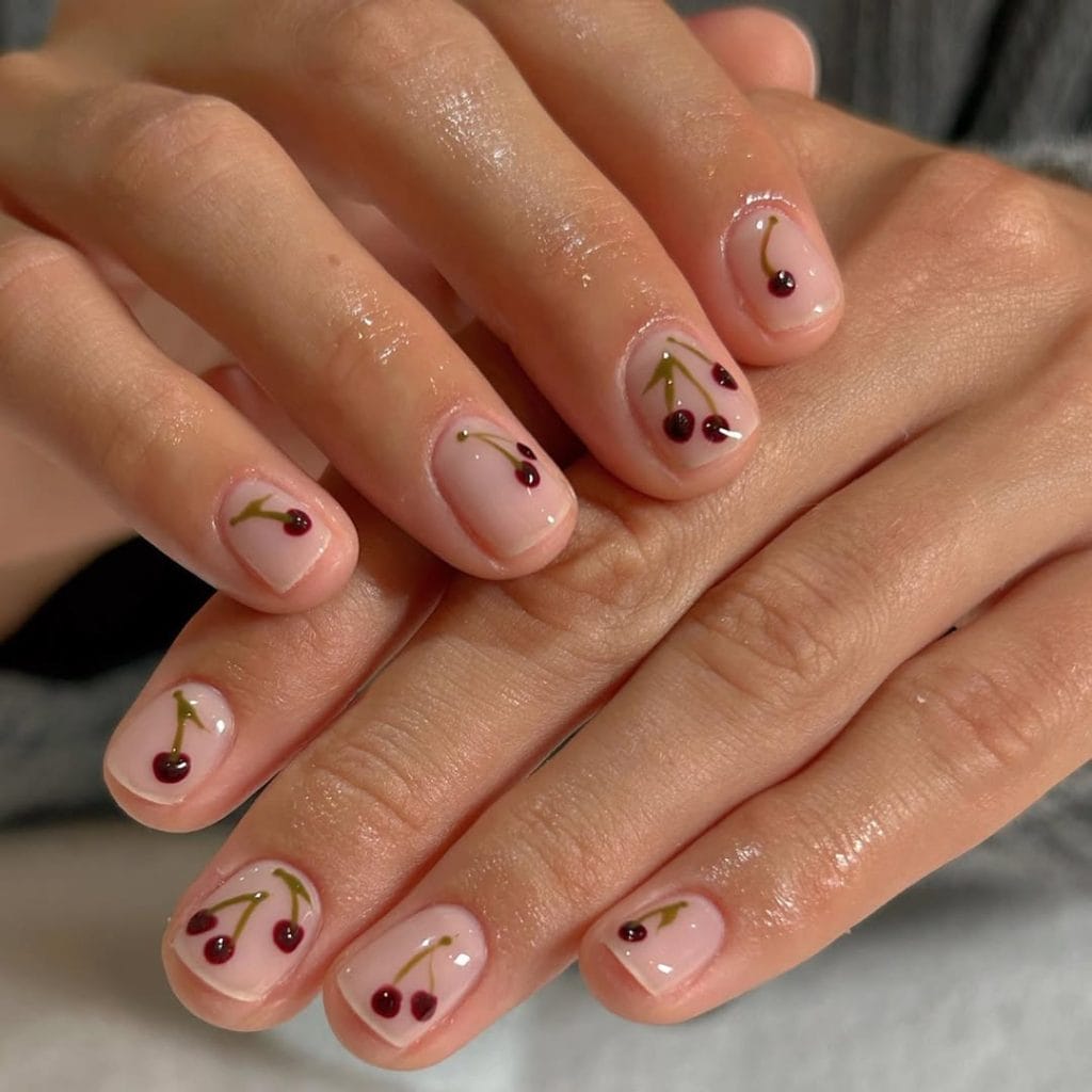 Short natural nails with minimal cherry art

