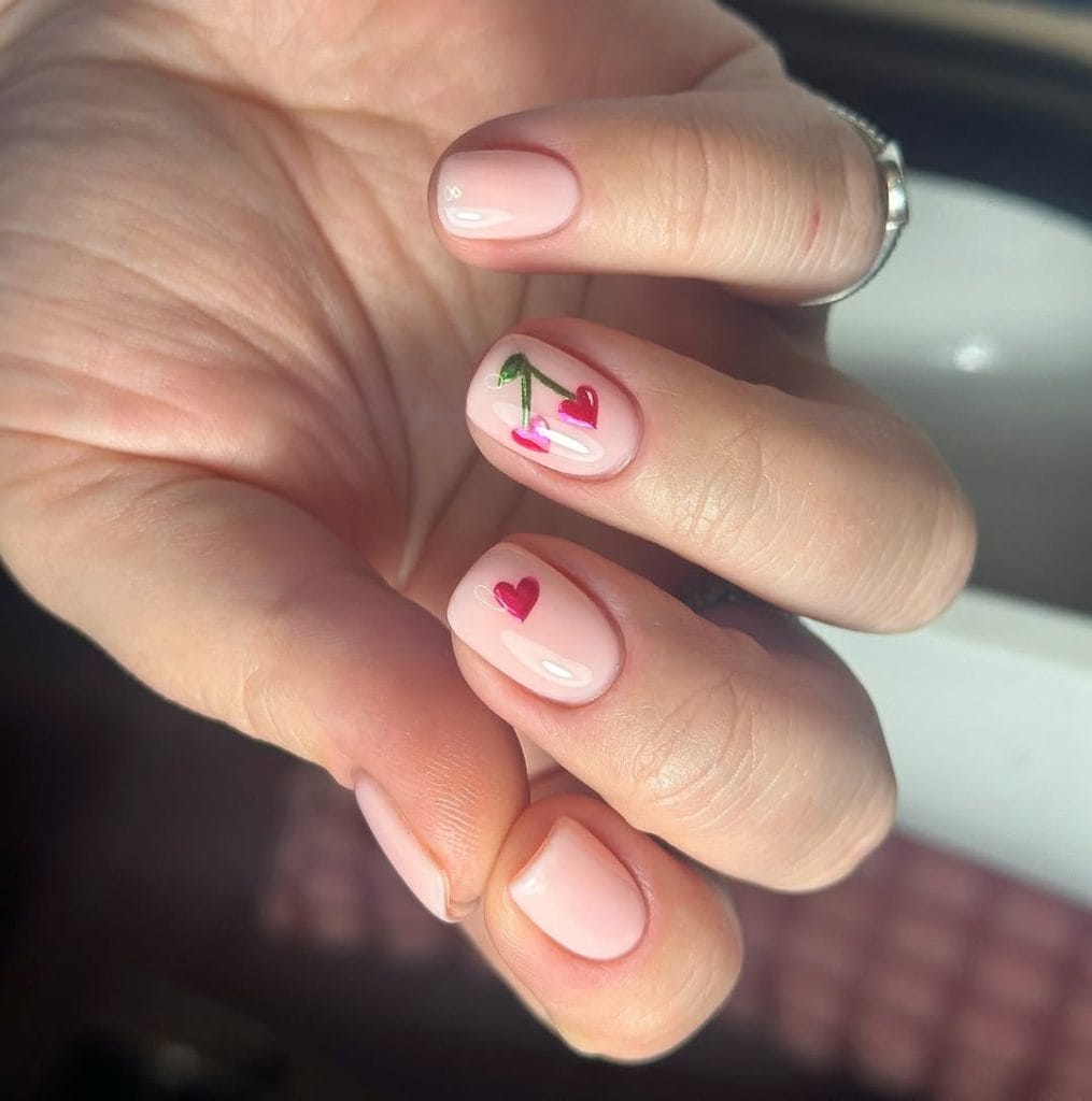 Simple short nails with cherry hearts design
