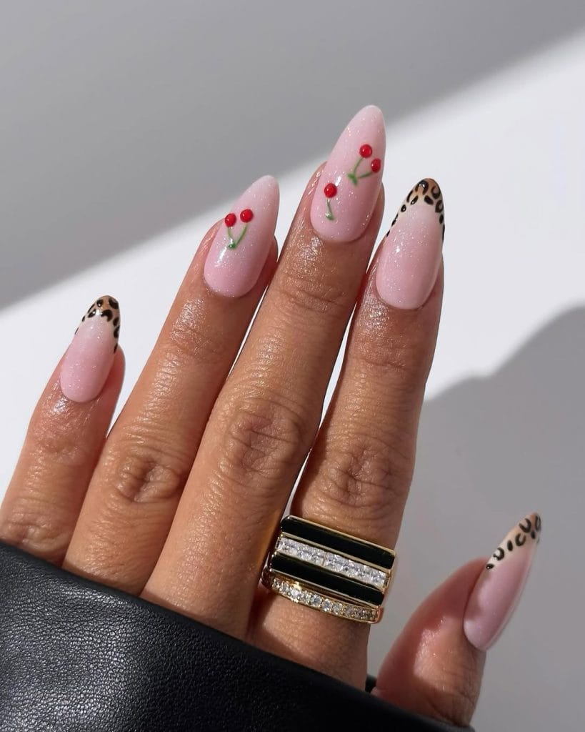 Simple cherry and animal print  accents on almond shaped nails
