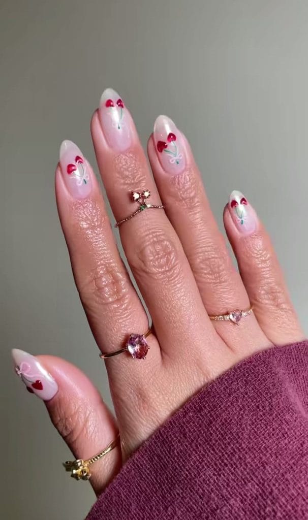French cherry design on nude pink nails

