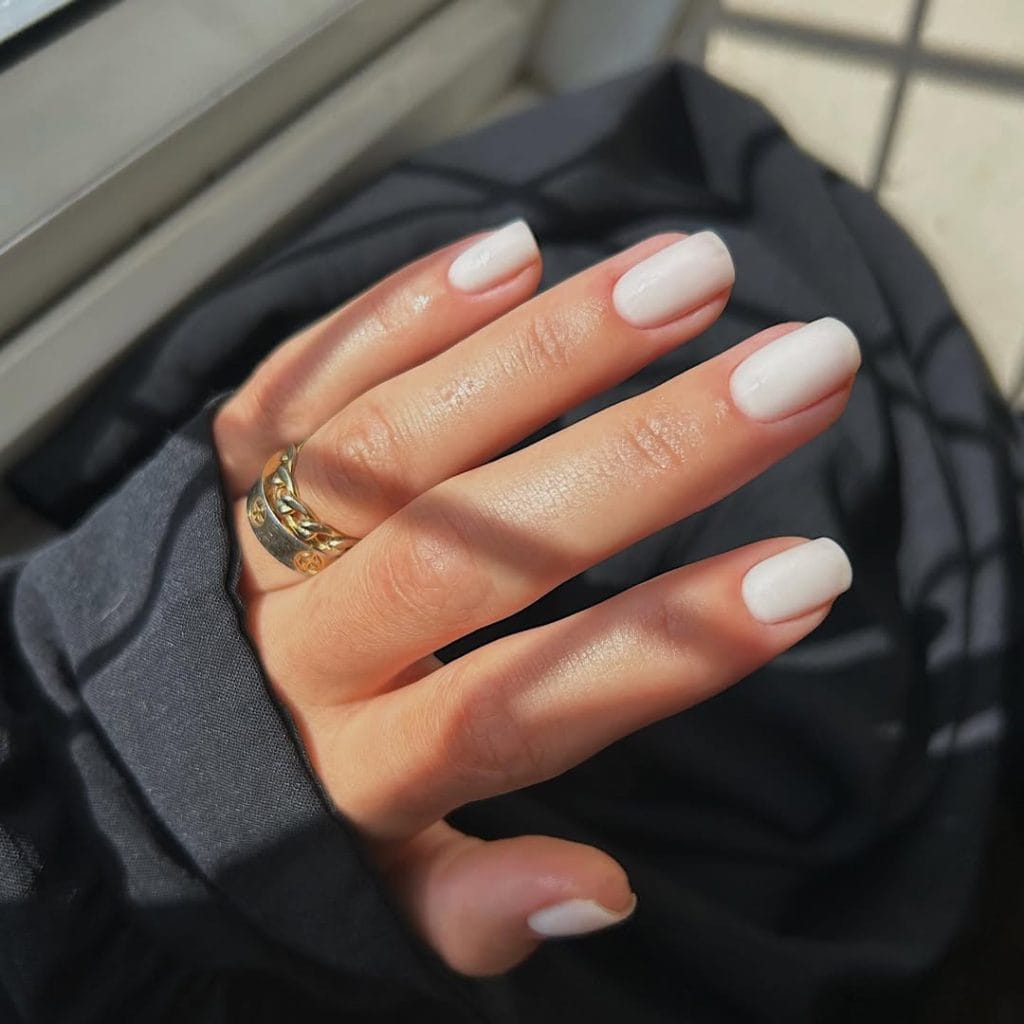  Classic white neutral nails on squoval shape with glossy finish

