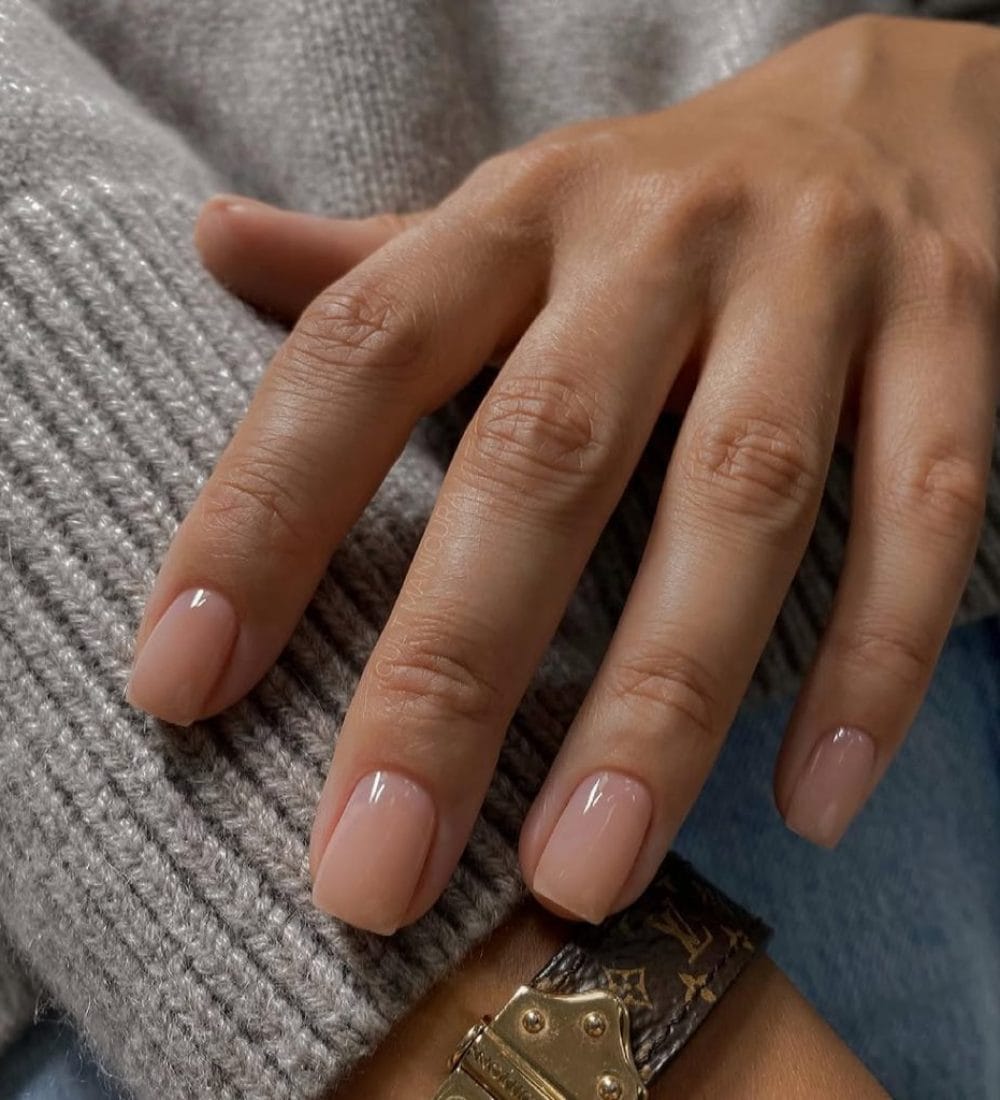 Soft beige neutral nails on square shape with glossy finish