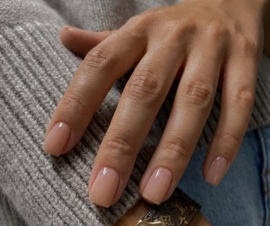 Soft beige neutral nails on square shape with glossy finish