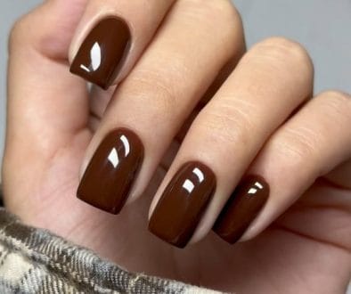 Short fall nails in chocolate brown with high gloss finish and square shape