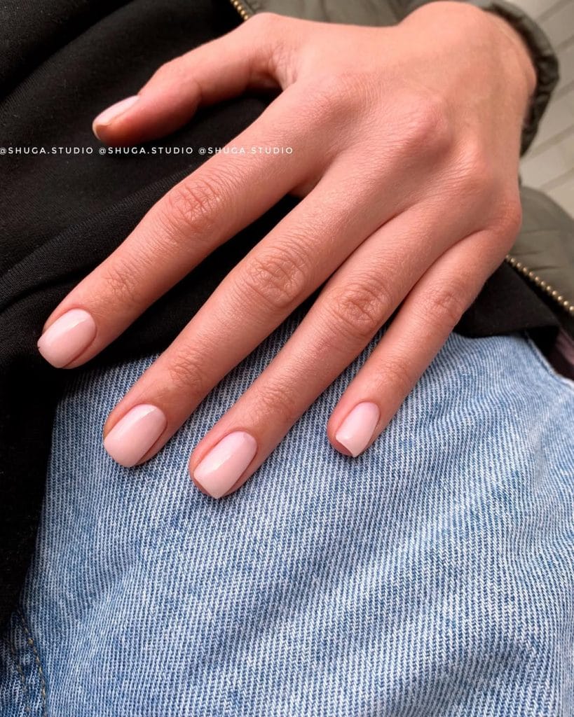 Nude pink neutral nails on short squoval shape with creamy finish 